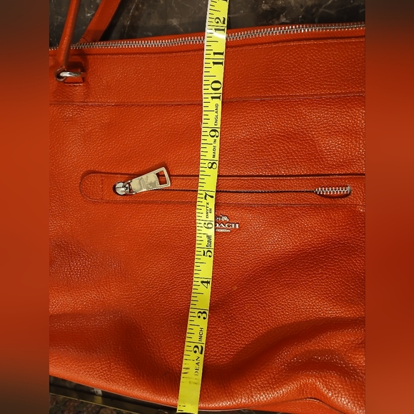 Coach Tyler Tote in an orange/red shade of pebbled leather. - Picture 10 of 16